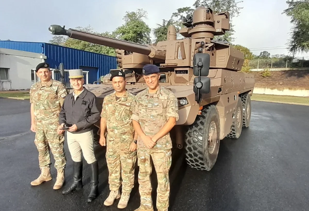 Cypriot National Guard officers together with a French officer in front of an EBRC Jaguar during their visit to France