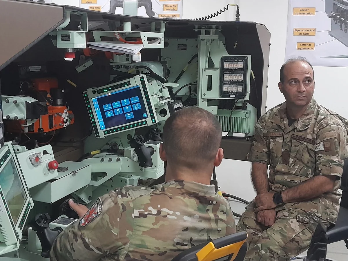 Cypriot officers at the turret simulator of the EBRC Jaguar at the Cavalry School in Saumur