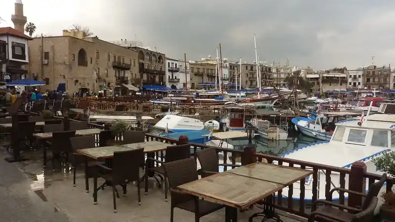 Boats moored in the old harbour of Kyrenia, with the waterfront buildings behind