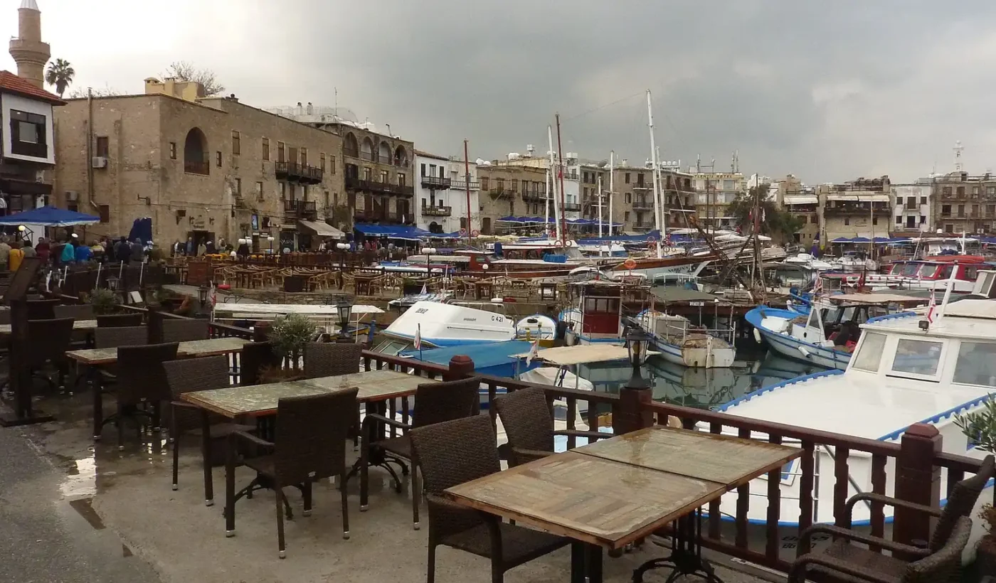 Boats moored in the old harbour of Kyrenia, with the waterfront buildings behind