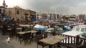Boats moored in the old harbour of Kyrenia, with the waterfront buildings behind