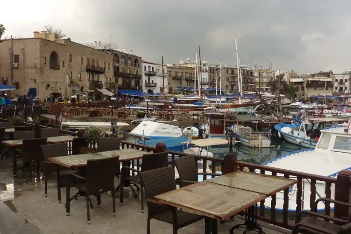 Boats moored in the old harbour of Kyrenia, with the waterfront buildings behind