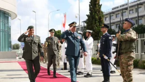 General Rodolph Haykal and Lieutenant General Emmanouil Theodorou salute as they pass in front of an honour guard at the National Guard General Staff