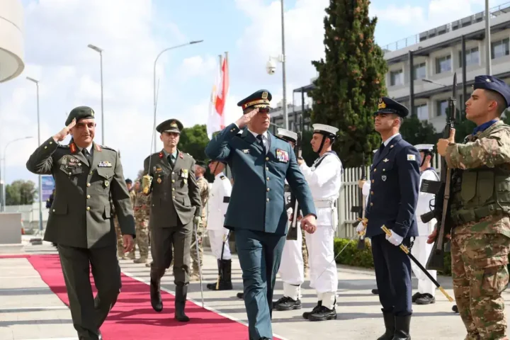 General Rodolph Haykal and Lieutenant General Emmanouil Theodorou salute as they pass in front of an honour guard at the National Guard General Staff