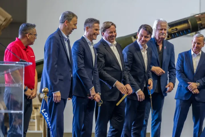 Lockheed Martin executives and guests at a ribbon-cutting event at the Grand Prairie facility