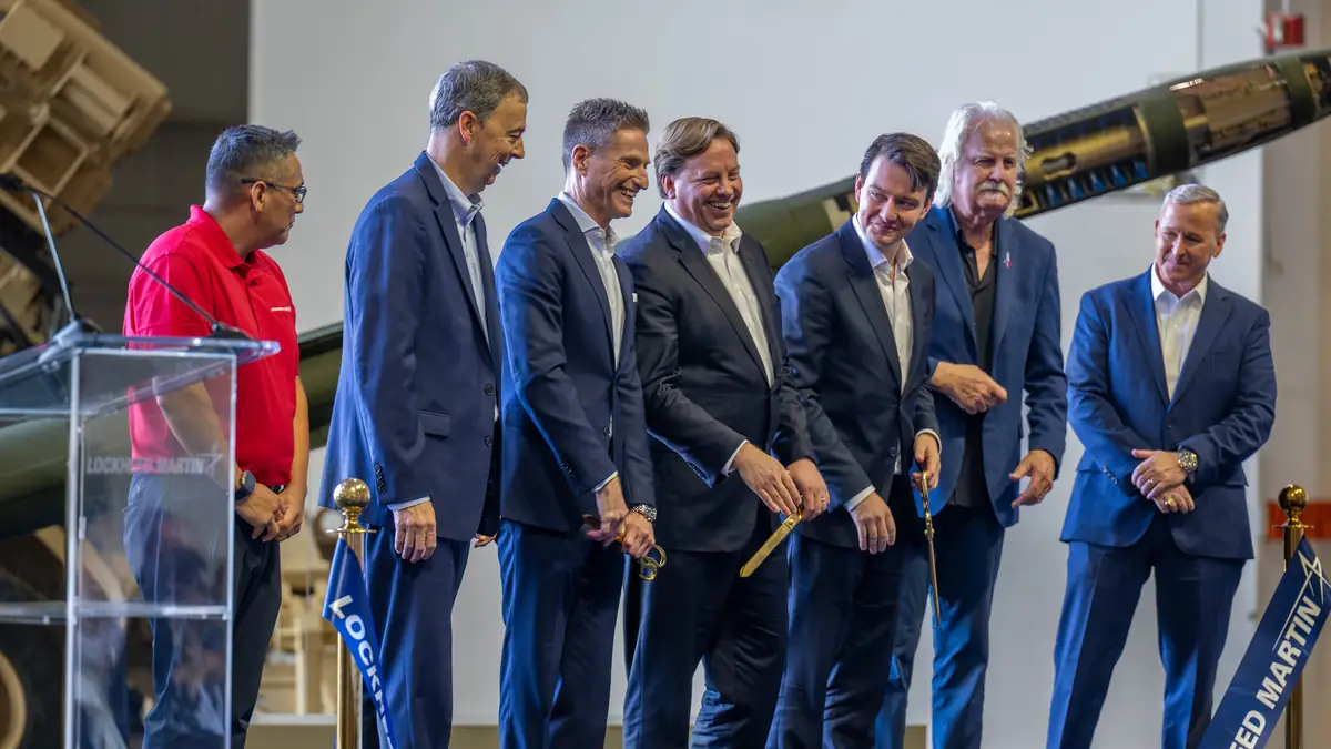 Lockheed Martin executives and guests at a ribbon-cutting event at the Grand Prairie facility
