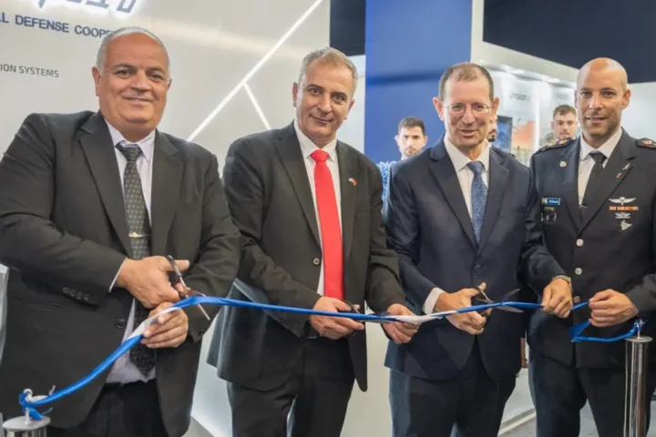 Four men cut a blue ribbon at the opening of the Israeli national defence pavilion at the Marrakech Airshow