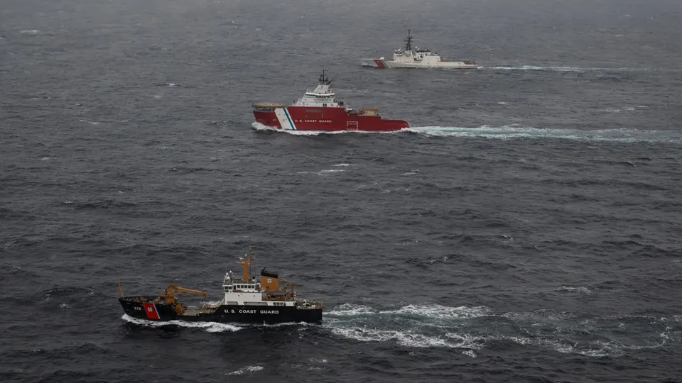 The cutter Munro sailing in formation with the cutters Storis and Fir in the Arctic Ocean