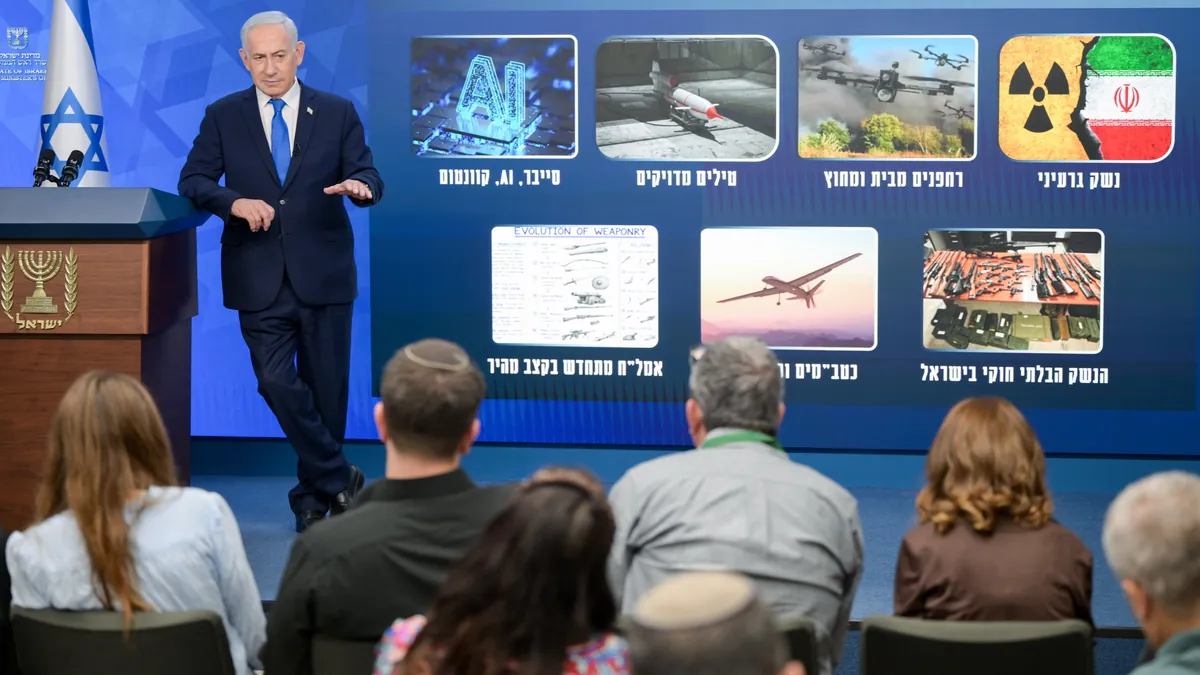Israeli Prime Minister Benjamin Netanyahu speaking at a security briefing for journalists in his Jerusalem office
