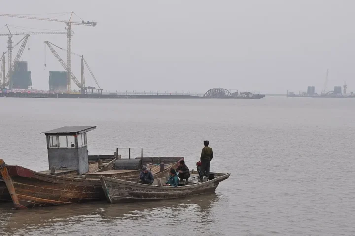 The New Yalu River Bridge under construction in June 2012, seen from the river near Dandong