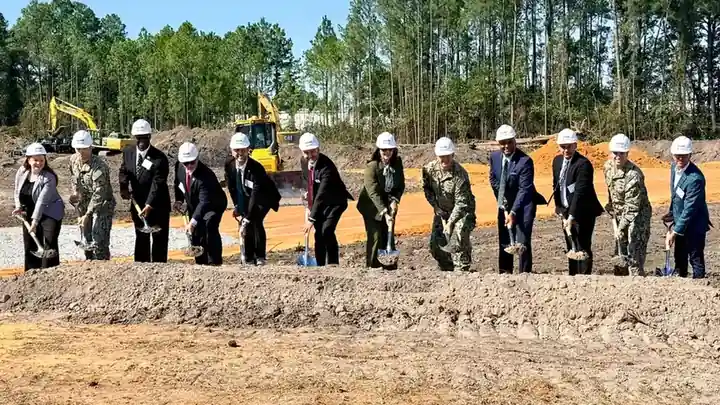 Navy, company and Australian Embassy representatives with shovels at the groundbreaking for a submarine components facility in Pascagoula, Mississippi