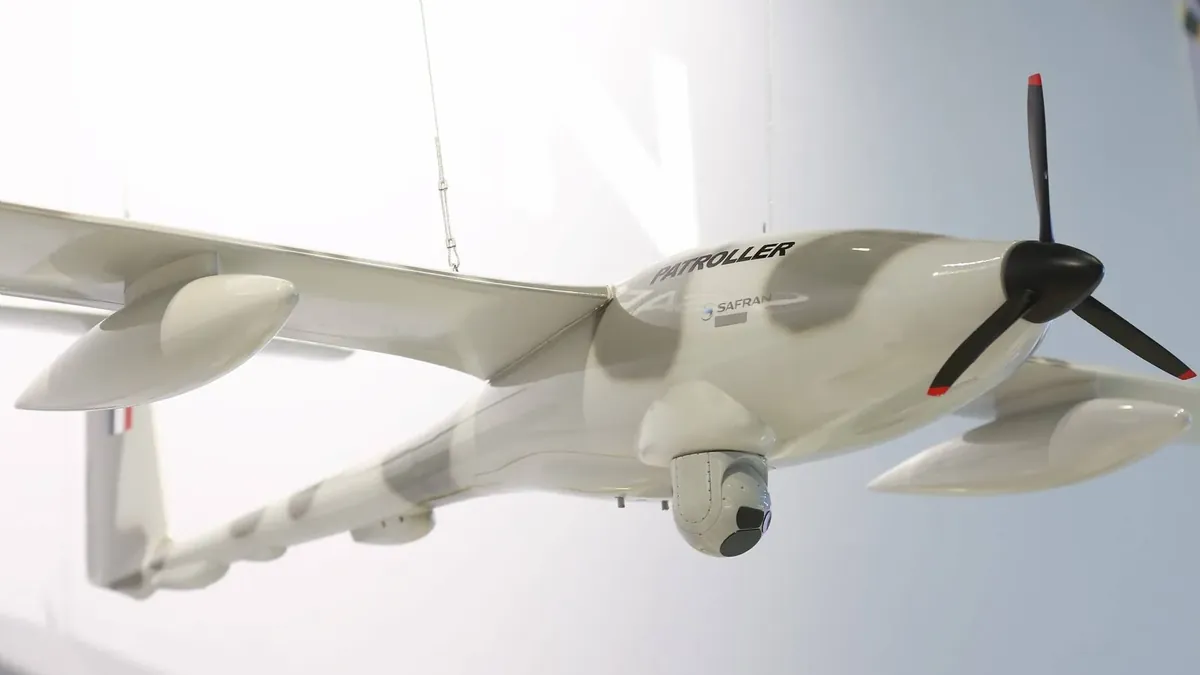 A Patroller with sensor pods and external fuel tanks under its wings