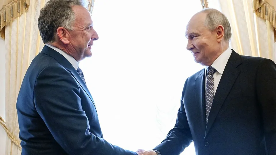 Vladimir Putin shaking hands with US special envoy Steve Witkoff at the Constantine Palace in St Petersburg