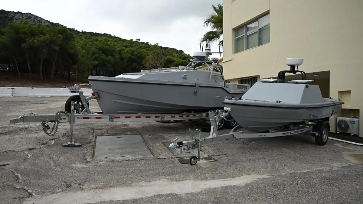 Saronic’s Corsair unmanned surface vessel (left) and the Greek Pyrpolitis (right) at Skaramangas