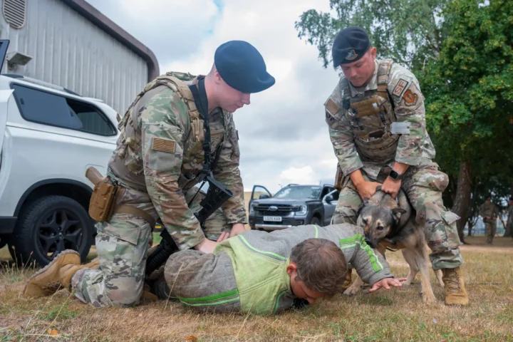 US Air Force security forces and military working dog in a July 2026 training exercise at RAF Fairford, England