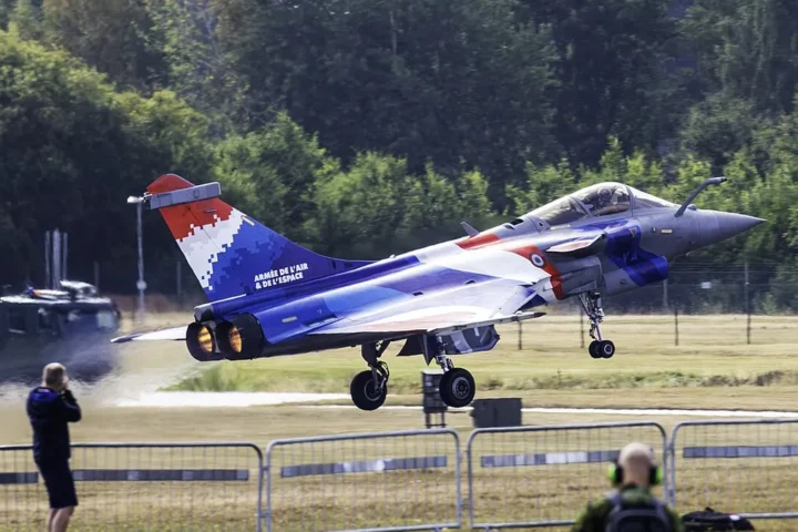 A Rafale C fighter in the tricolour livery of the French Air and Space Force taking off