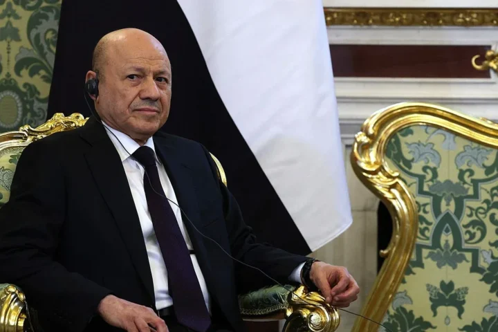 Rashad al-Alimi seated beside the Yemeni flag during a May 2025 visit to Moscow