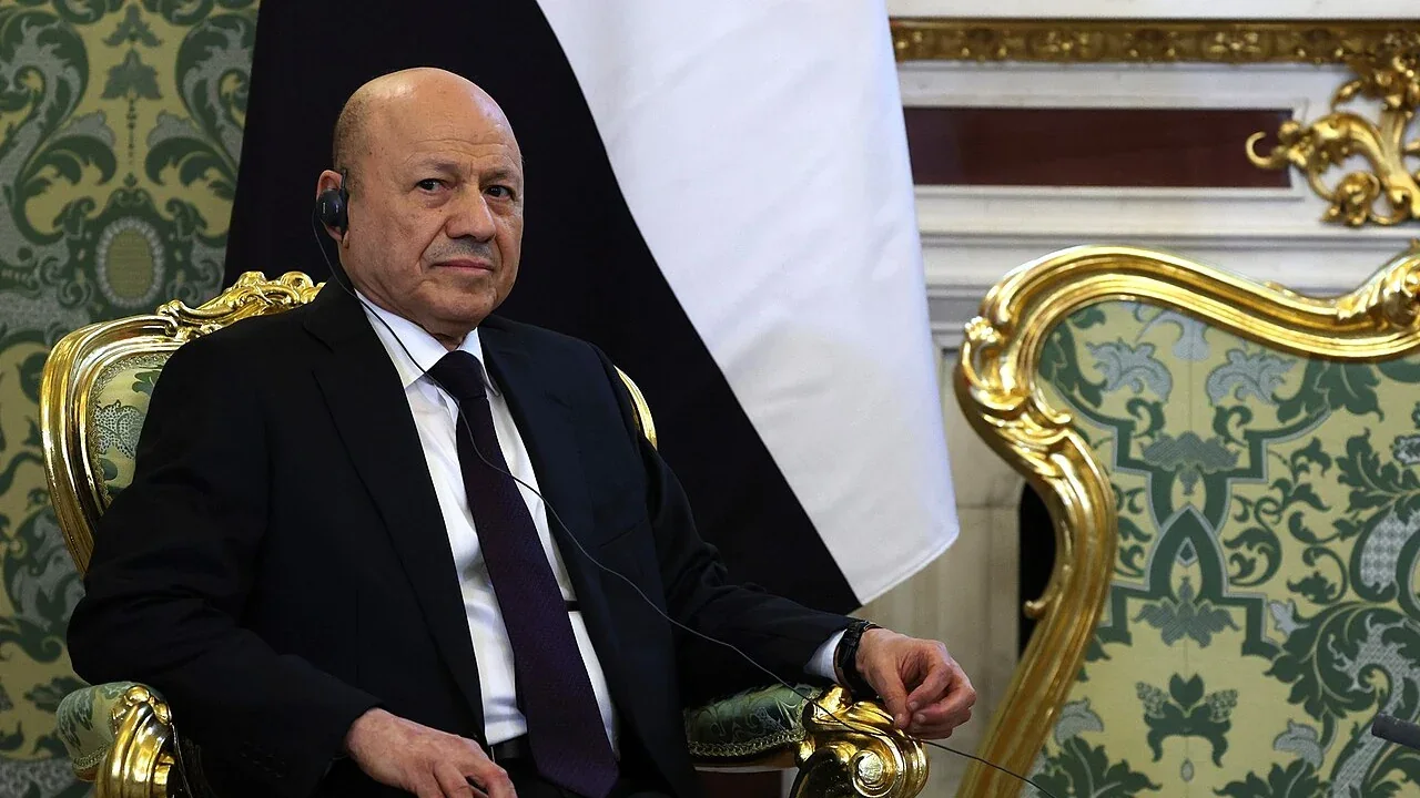 Rashad al-Alimi seated beside the Yemeni flag during a May 2025 visit to Moscow