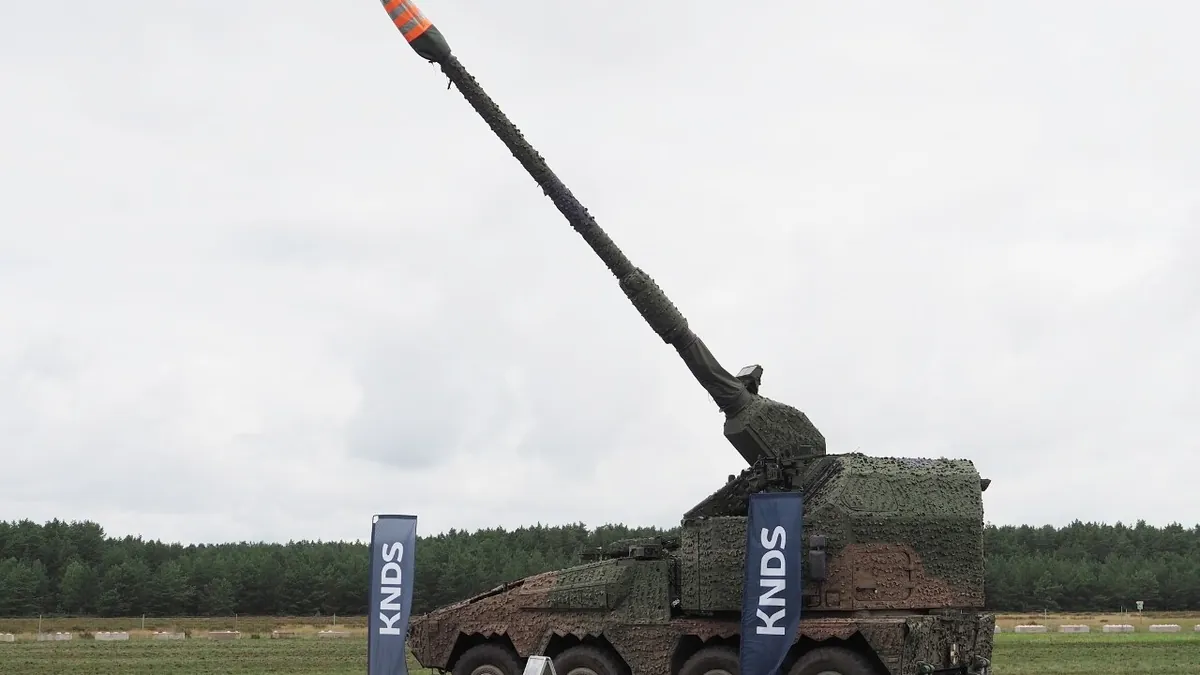 A KNDS RCH 155 wheeled self-propelled howitzer with its barrel raised on static display at the Klietz training area, Germany