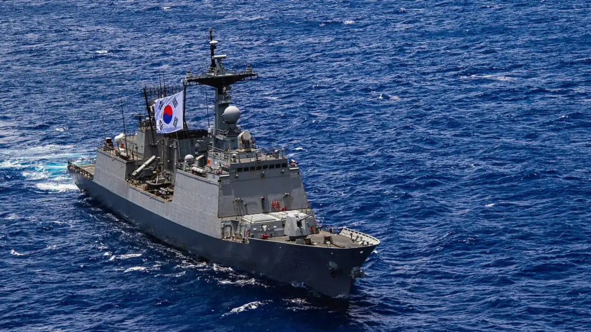 A grey destroyer sailing on the ocean