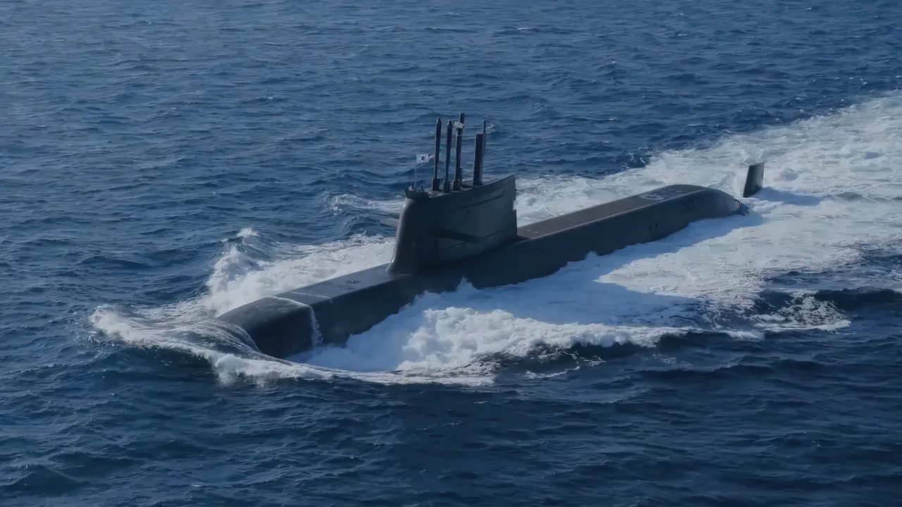 A South Korean KSS-III submarine of the Dosan Ahn Changho class surfaced and under way, throwing up a bow wave