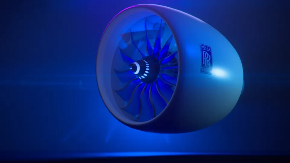 Computer-generated illustration of a Rolls-Royce jet engine with a lit fan, shown against a blue background