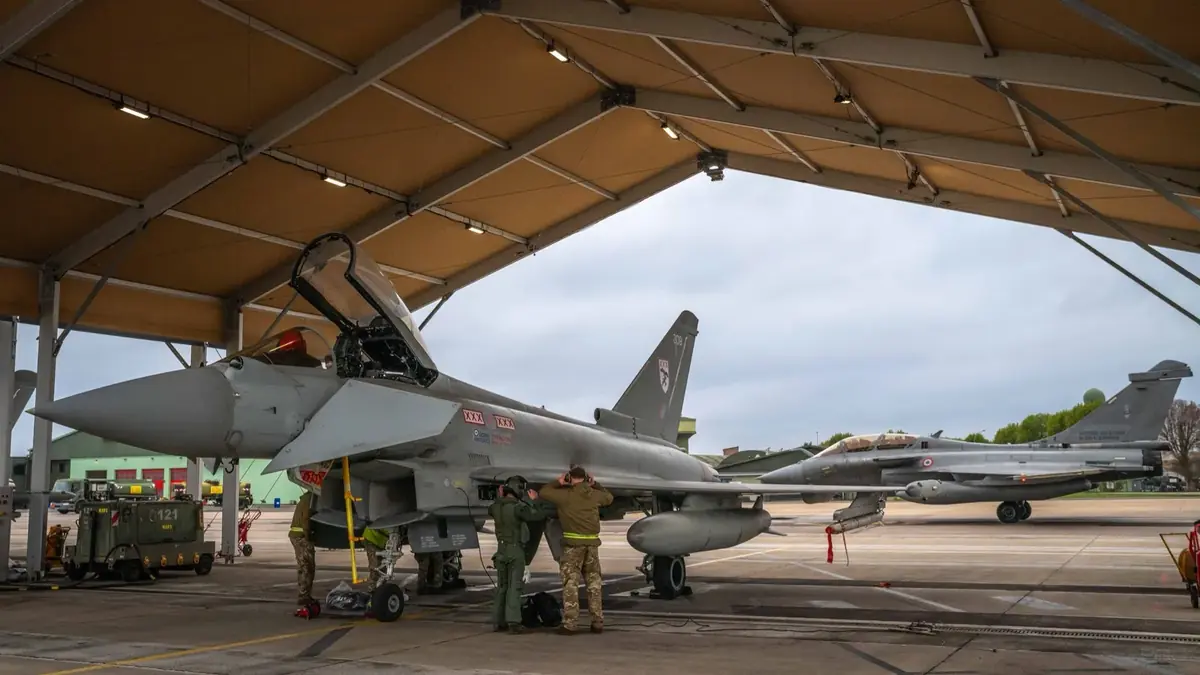 A Typhoon of No. 29 Squadron RAF in a hardened shelter next to a French Rafale