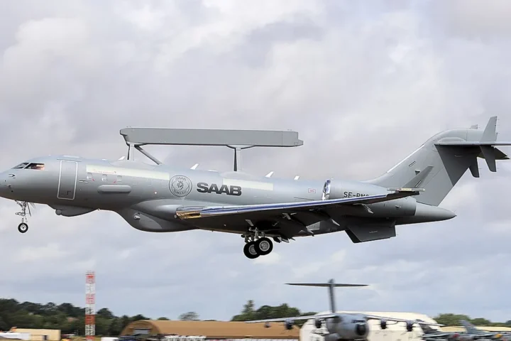 A Saab GlobalEye airborne early warning aircraft with its radar bar on the fuselage landing at an air show
