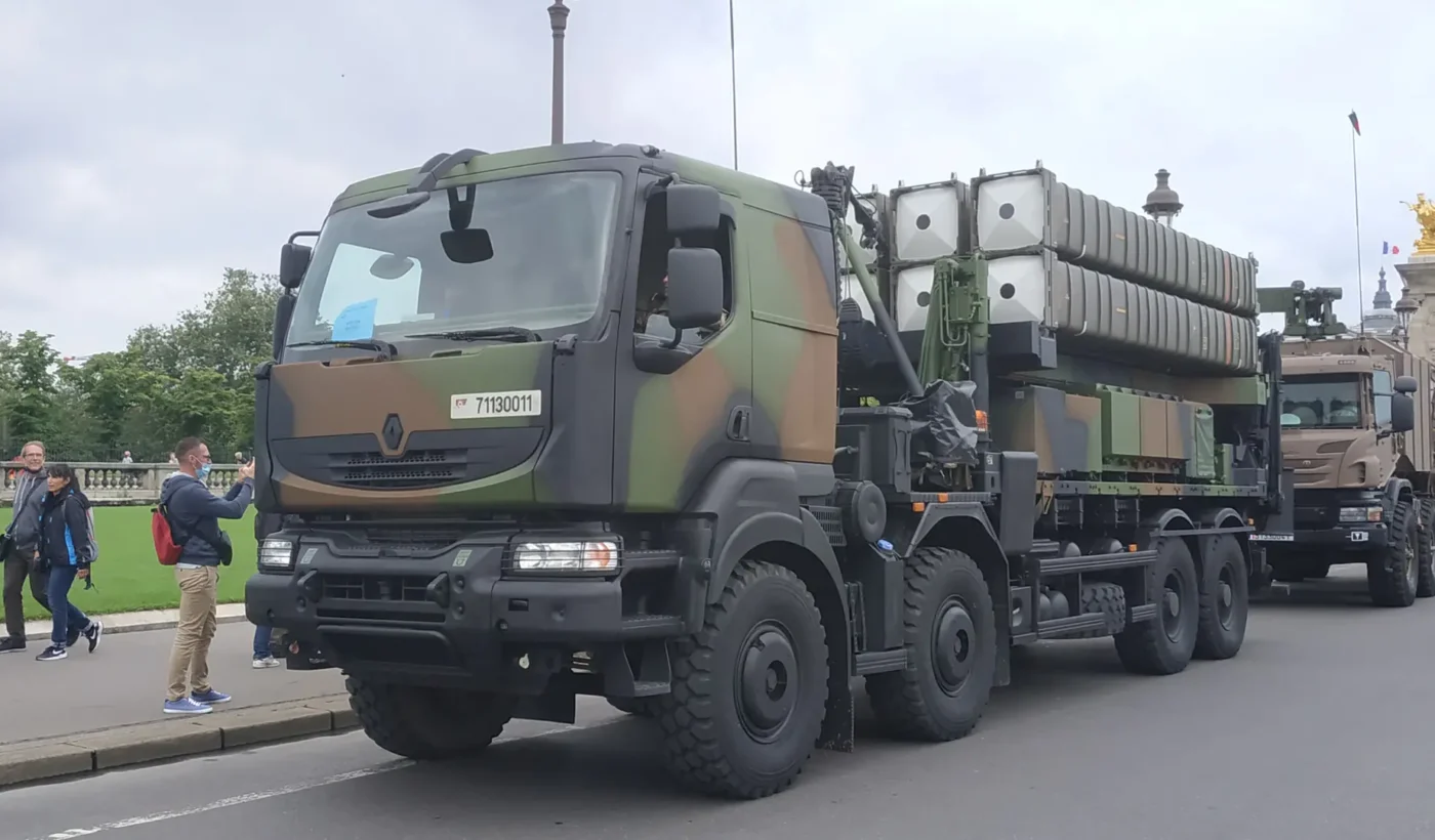 A SAMP/T launcher of the French Army, a camouflaged 8x8 truck carrying missile canisters, on a street in Paris