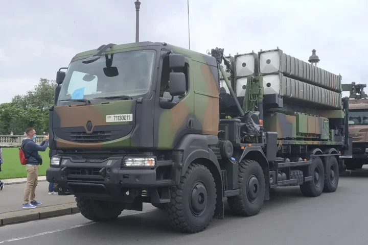 A SAMP/T launcher of the French Army, a camouflaged 8x8 truck carrying missile canisters, on a street in Paris