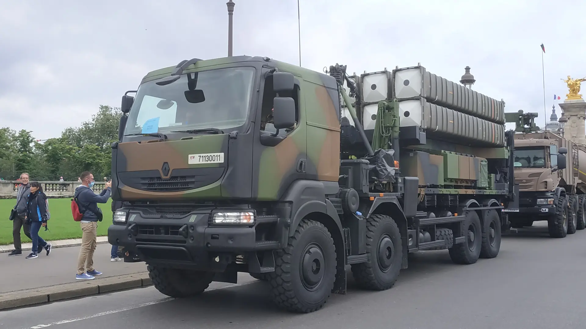 A SAMP/T launcher of the French Army, a camouflaged 8x8 truck carrying missile canisters, on a street in Paris