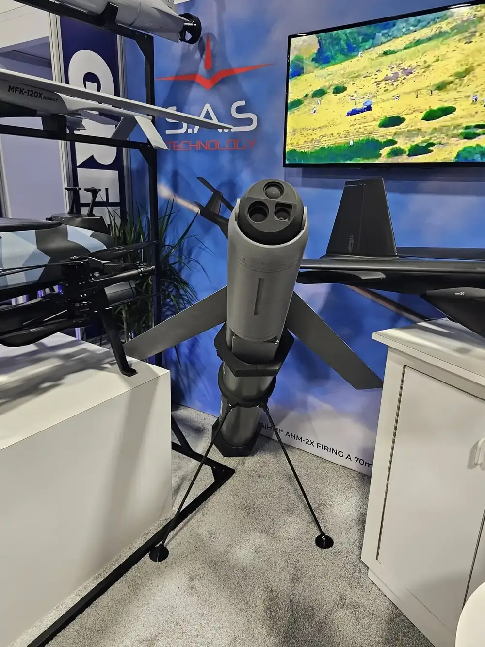 The portable Spearhead loitering munition on a tripod, with a three-aperture electro-optical head and fins, at the SAS Technology booth