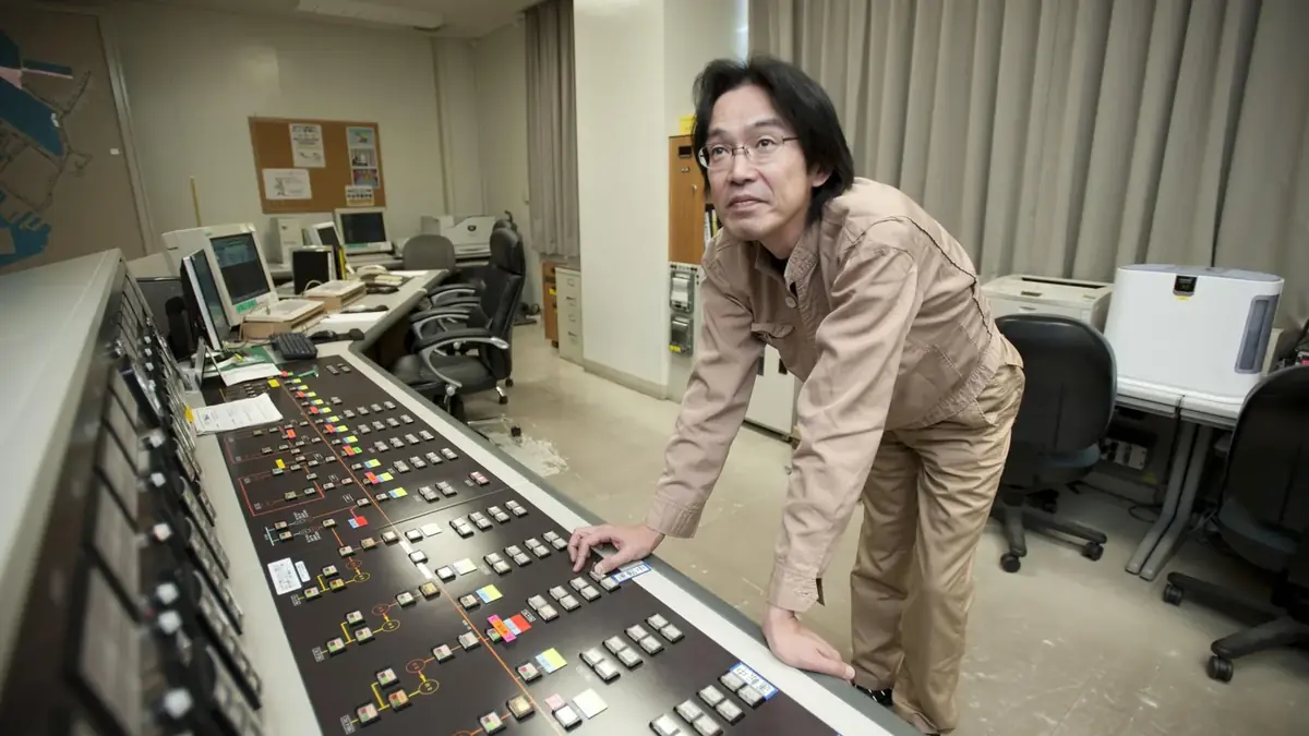 A power distribution supervisor operates a SCADA system in the control room of the US naval base in Yokosuka, Japan, in 2011