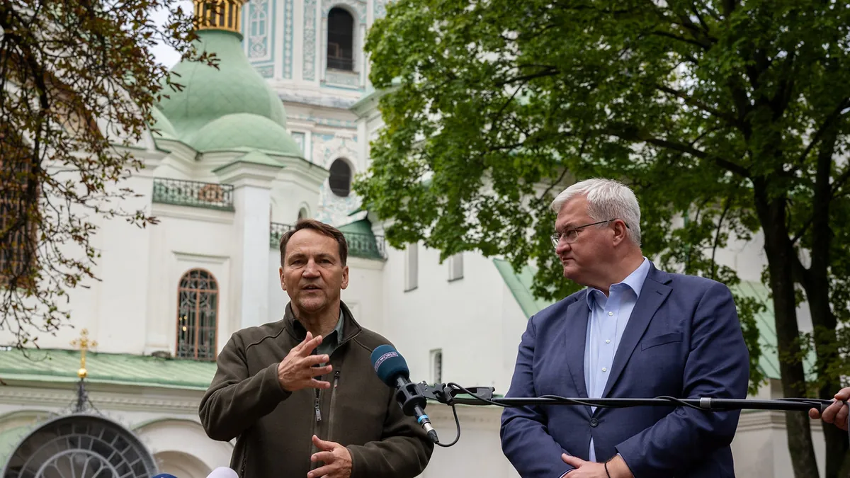 Polish Foreign Minister Radosław Sikorski at a press conference in front of St. Sophia Cathedral in Kyiv