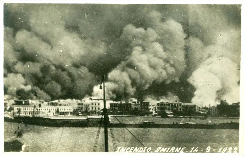 Smoke rising over the waterfront of Smyrna during the fire of September 1922, photographed from a ship