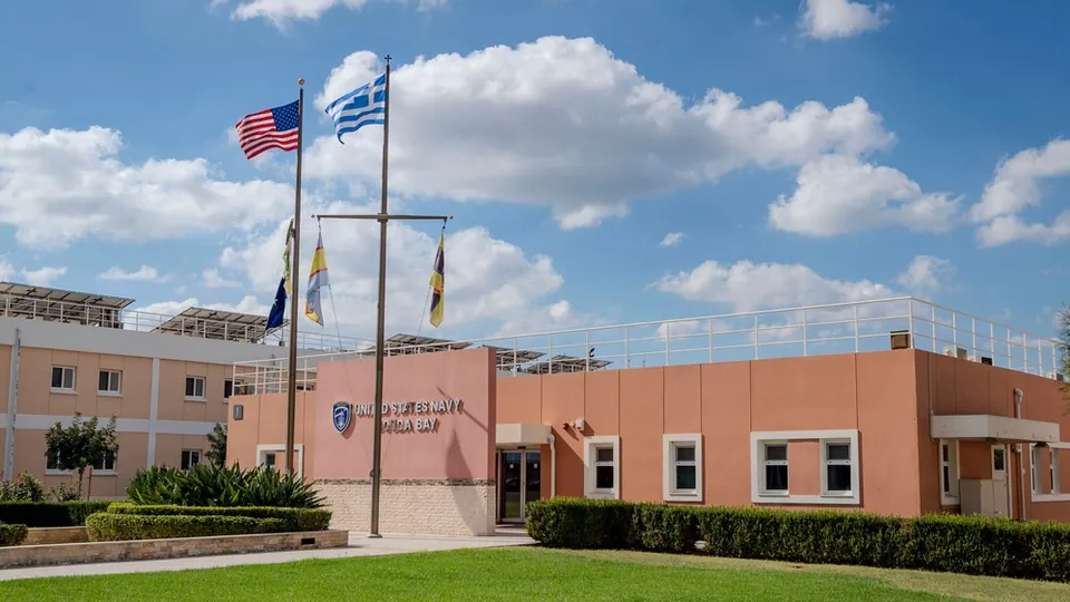 Headquarters building of U.S. Naval Support Activity Souda Bay with American, Greek and NATO flags