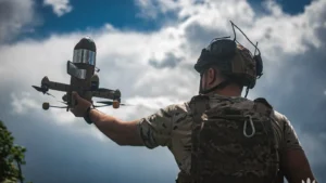 A soldier of the 114th Territorial Defence Brigade launching a Sting interceptor drone