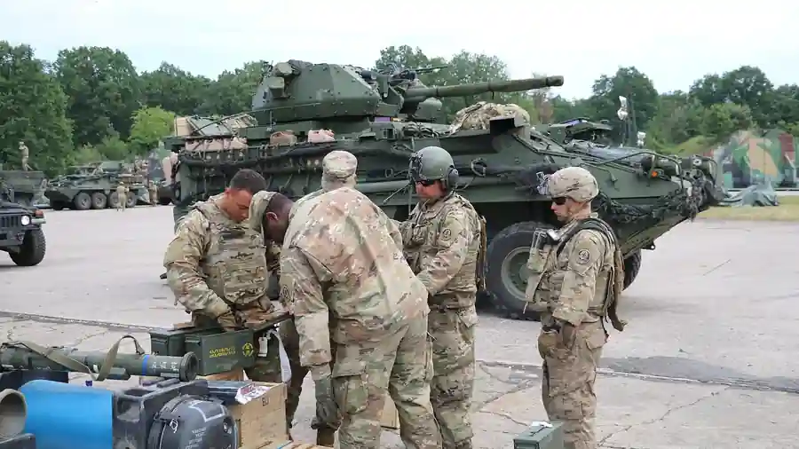 US Army soldiers loading 30 mm ammunition into a Stryker ICV-D