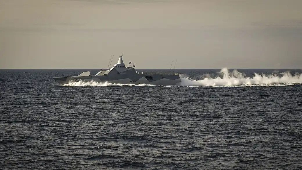A Swedish Visby-class corvette moving fast through the Baltic Sea, trailing spray (file photo)