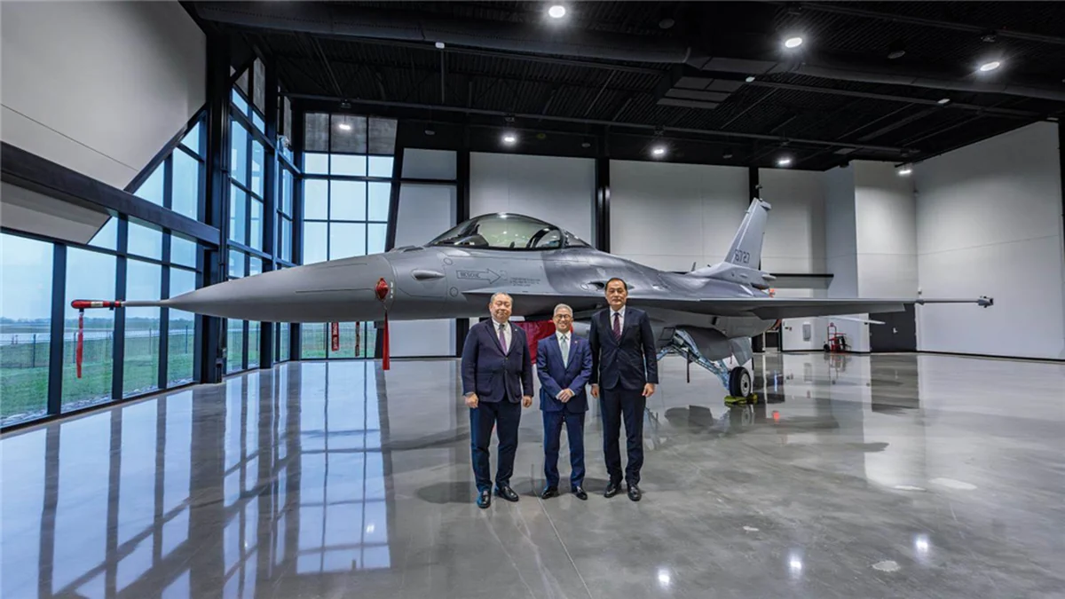 Taiwan defence officials beside an assembled F-16 Block 70 in a US hangar in March 2026, before the first two aircraft arrived in Taiwan