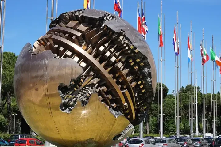 Flags and a bronze sculpture outside the Farnesina building in Rome
