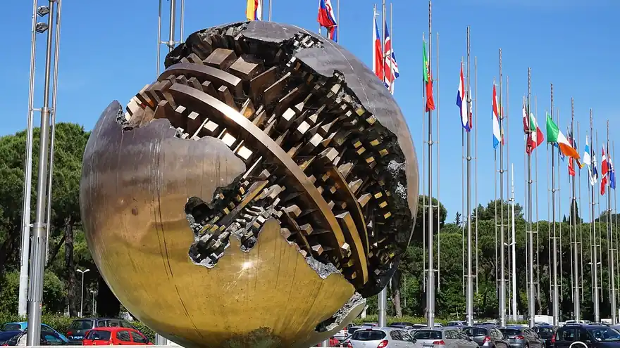 Flags and a bronze sculpture outside the Farnesina building in Rome
