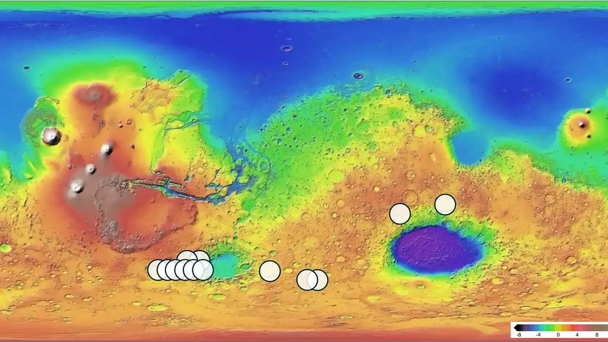 Map of Mars with 13 areas (white circles) matching the mineralogy and chemistry of the Teghaza 001 meteorite, mostly in the southern highlands
