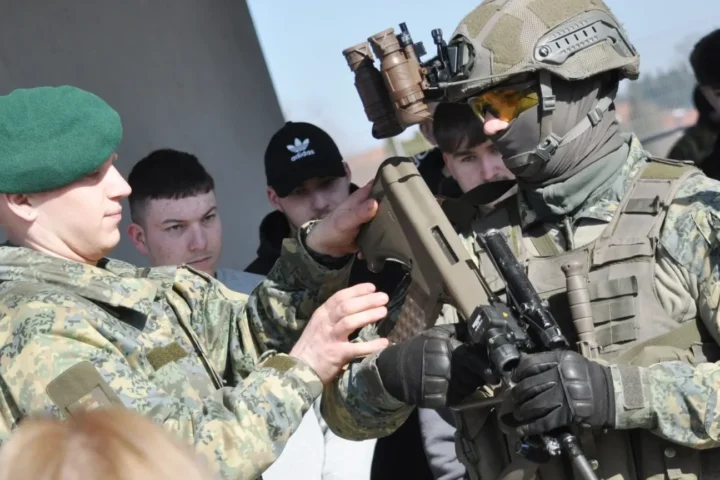 Austrian soldier wearing THEON NSB-3D NYX night vision goggles, archive June 2024