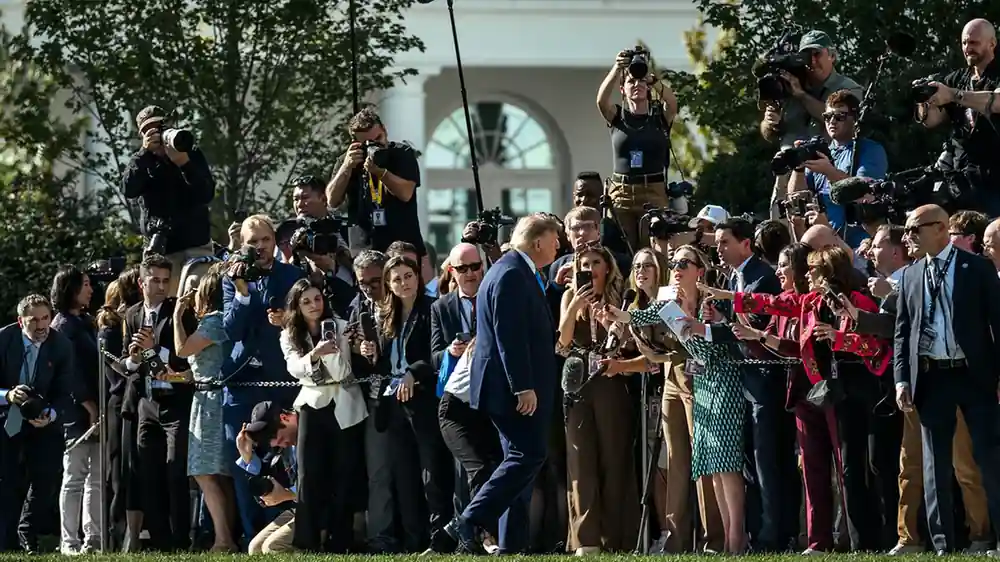Donald Trump speaking to reporters on the South Lawn of the White House