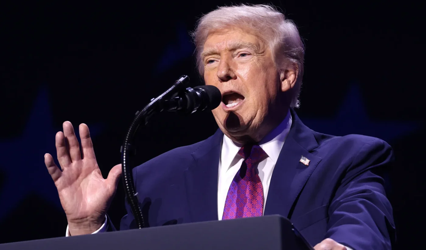 Donald Trump speaks into a microphone at a rally in Phoenix, Arizona, on April 17, 2026