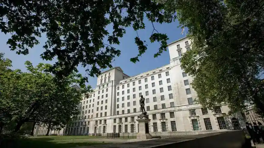 The Ministry of Defence Main Building in Whitehall, London, seen through trees