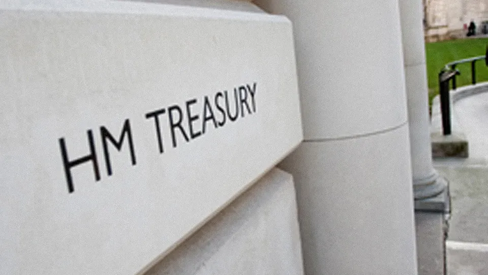 The HM Treasury name carved into stone at the entrance of the Treasury building in London