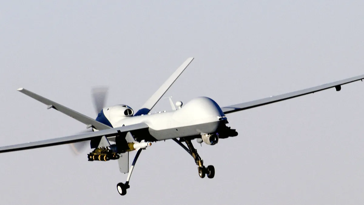 A U.S. Air Force MQ-9 Reaper unmanned aircraft in flight with weapons under its wings
