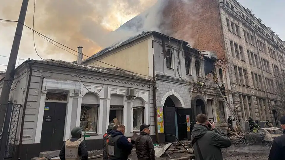 Rescue workers at a building housing a kindergarten and school in Kharkiv, Ukraine, after an air strike (file image)
